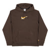 The NIKE SB OSKI ORANGE LABEL HOODIE BROWN by Nike features a front pouch pocket, hood, yellow-orange NIKE SB Swoosh logo across the chest, and an Orange Label logo near the left cuff.