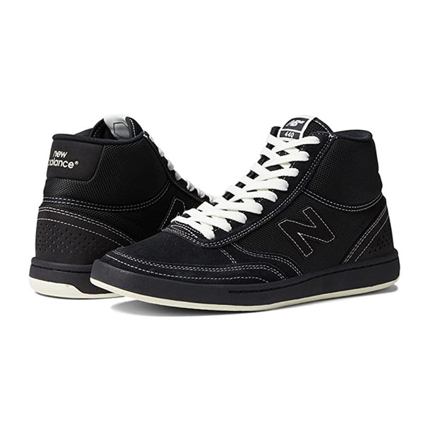 A pair of black NB Numeric 440 High Black/White sneakers by NB Numeric with white laces.