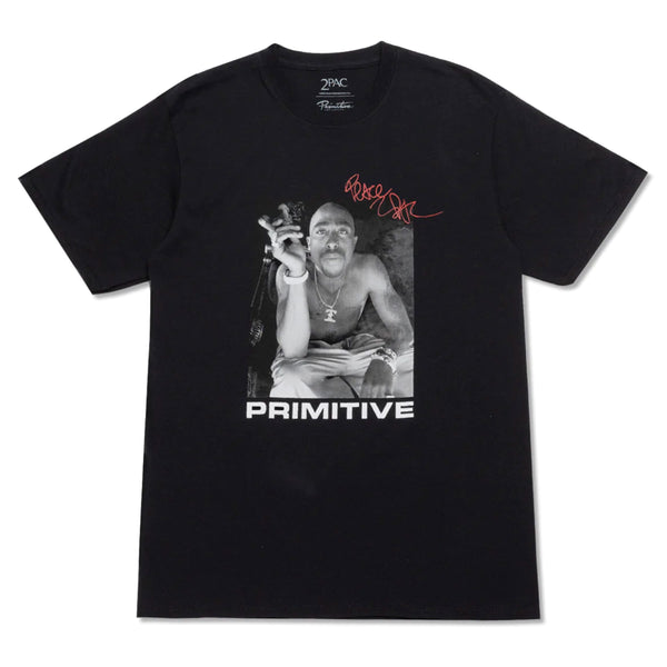 The PRIMITIVE X TUPAC SMOKE TEE BLACK features a black-and-white image of a person holding a cigar and wearing a bandana, with "PRIMITIVE" written below and a red signature above—a limited edition piece from Primitive.
