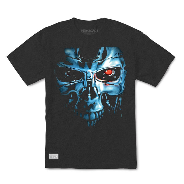 The PRIMITIVE X TERMINATOR 2 ENDO TEE BLACK by PRIMITIVE features a graphic design of a metallic, skull-like face with glowing red eyes. Reminiscent of Terminator 2, this T-shirt showcases a futuristic robot or cyborg, with the left eye particularly highlighted in red.