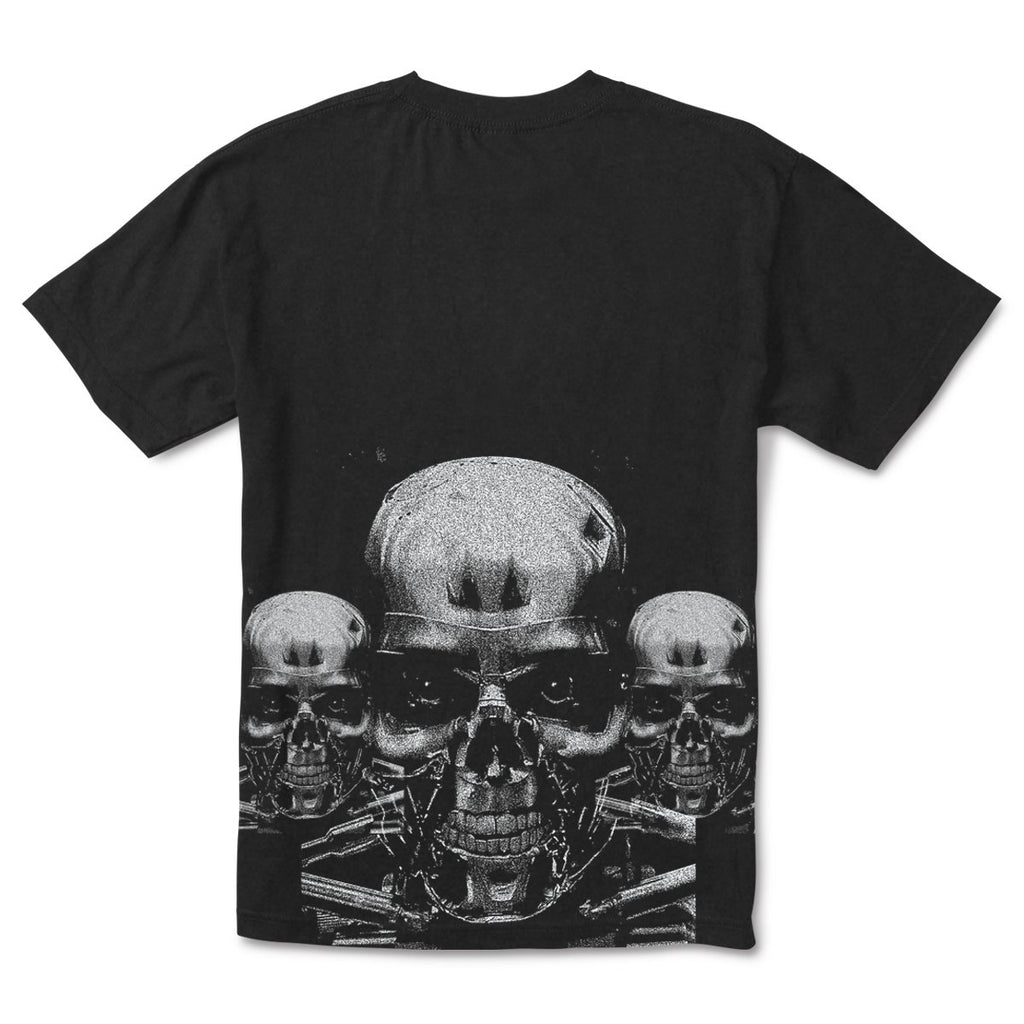 The PRIMITIVE X TERMINATOR 2 Terminator Tee in black showcases a detailed metallic skull graphic with two smaller skulls in the background, reminiscent of the Terminator aesthetic.