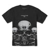 Black tee by Primitive, featuring a graphic of three metallic-toned skulls with the word "PRIMITIVE" above the central skull. This design is part of the PRIMITIVE X TERMINATOR 2 TERMINATOR TEE BLACK collection.