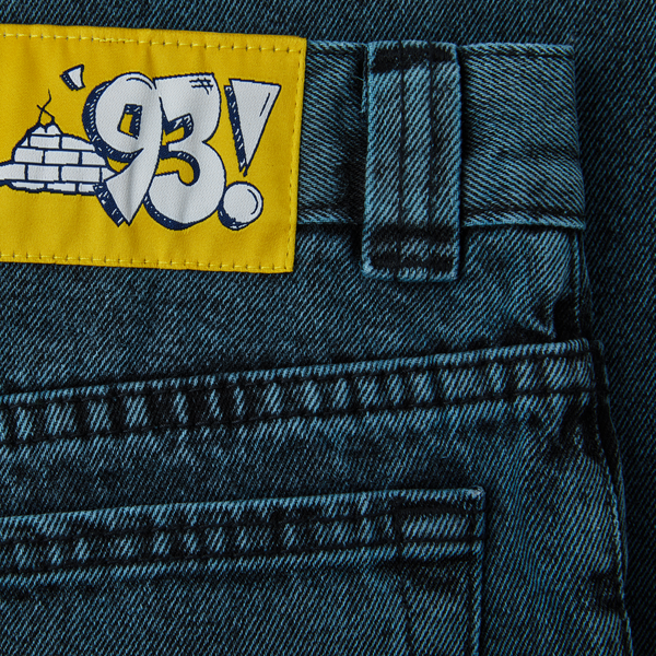 A patch of POLAR '93! DENIM CYAN BLACK on the back of a pair of jeans by POLAR.