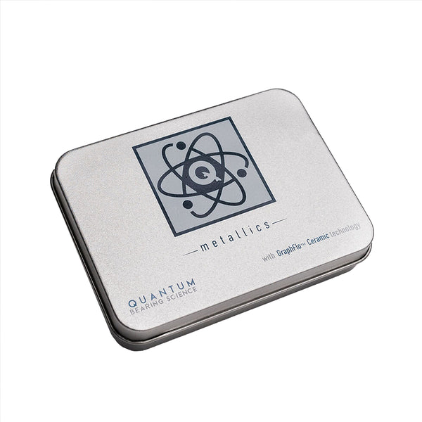 A silver tin with a logo on it, showcasing the Quantum Metallic Series Bearings by Quantum Bearings and exuding stability and mechanical strength.