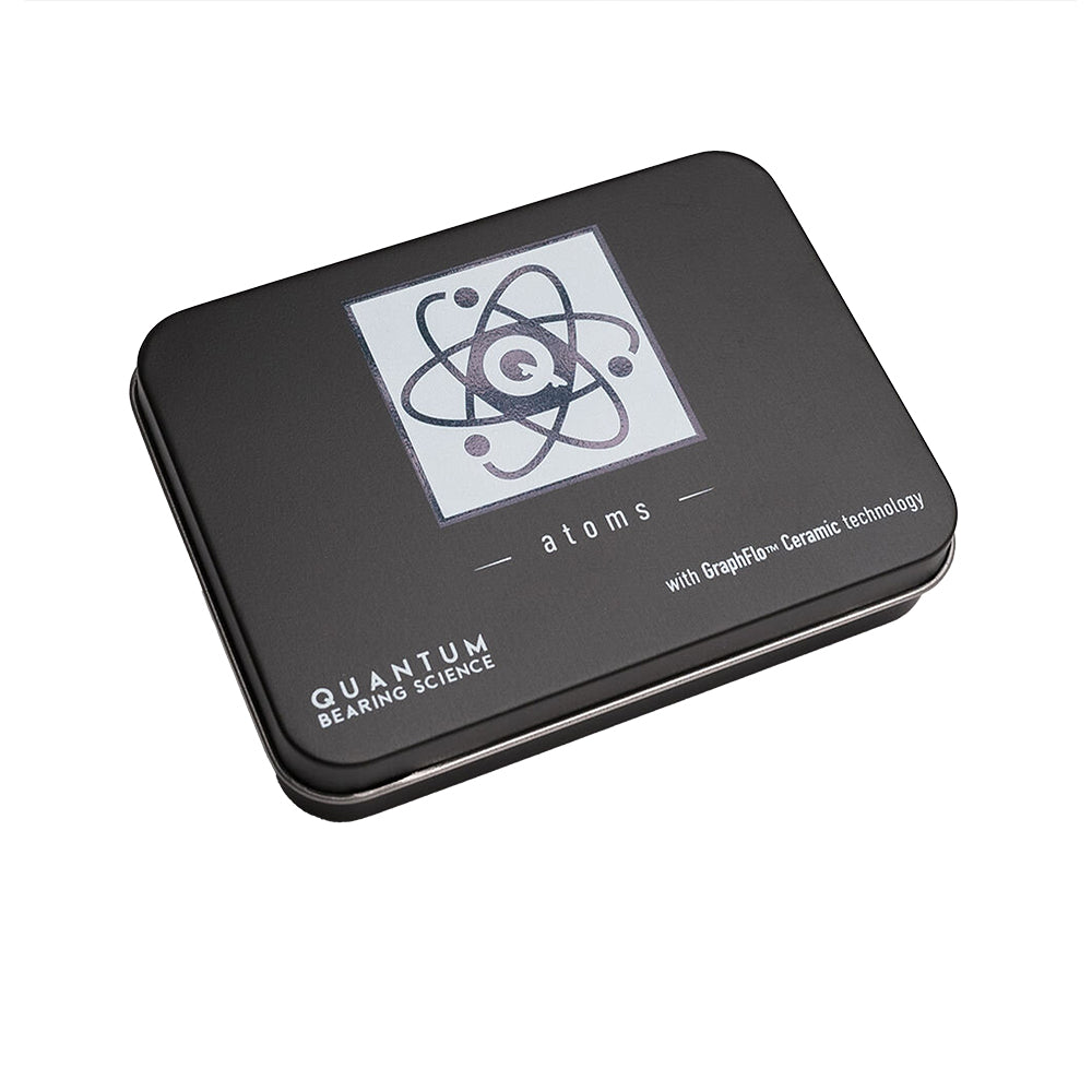 A black tin with an image of the QUANTUM ATOM CERAMIC HYBRID BEARINGS on it, showcasing Quantum Bearings' frictional resistance and speed capabilities.
