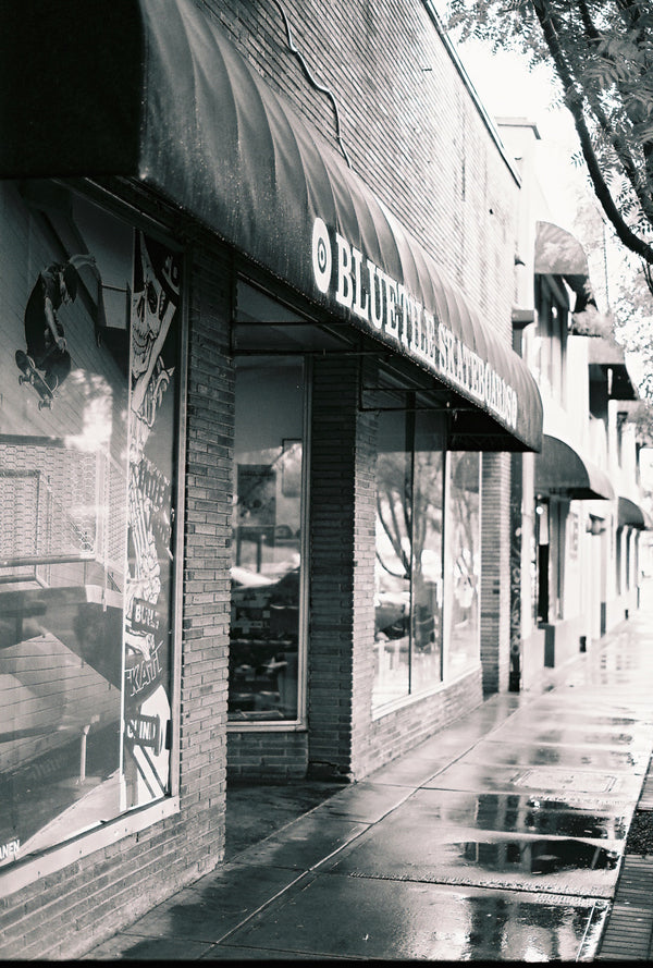Shawn Gerald captured a stunning Bluetile by Shawn Gerald photo print of the wet sidewalk with Bluetile Skateboards.