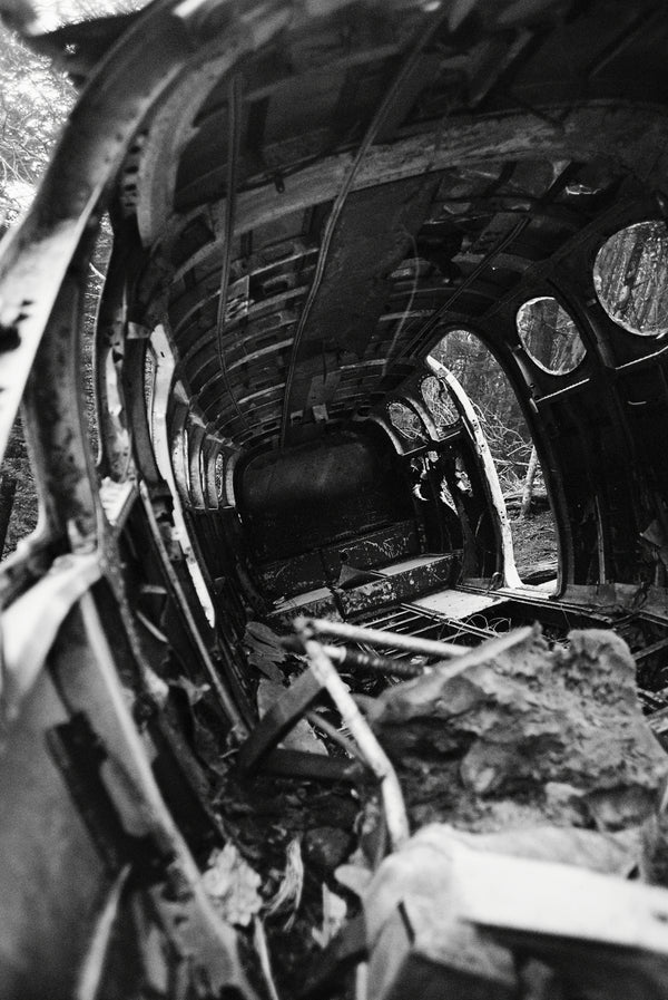A black and white photo of a wrecked airplane Crash by Shawn Gerald.