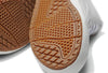 A close up of the durable sole of a white and brown VANS THE LIZZIE MARSHMALLOW shoe.