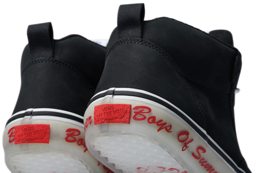 A pair of black VANS BOYS OF SUMMER SKATE MC VCU shoes with red writing on them.