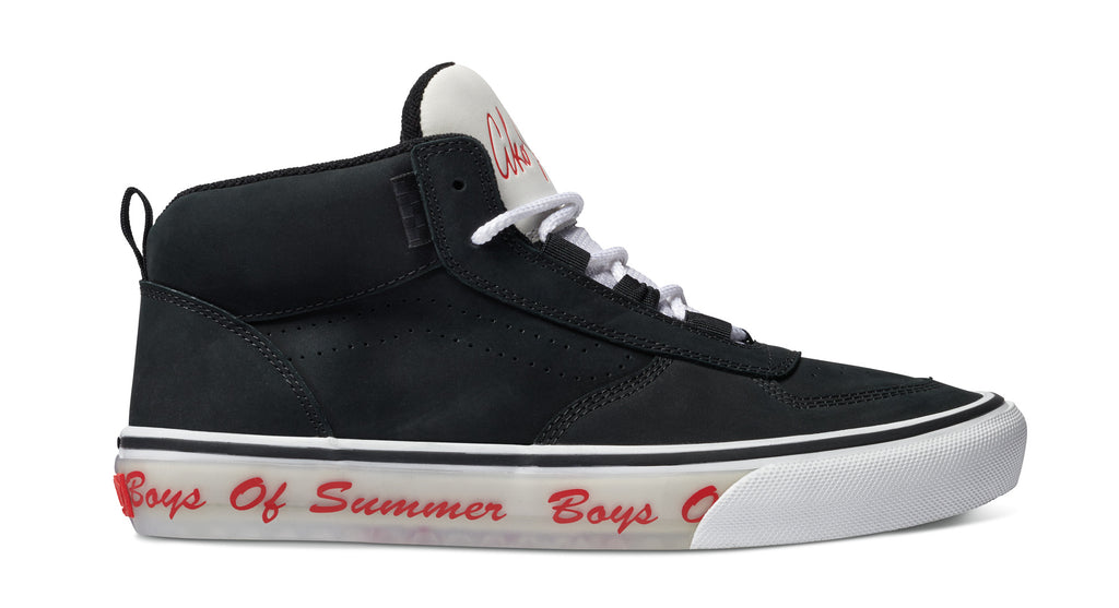 A black and white sneaker with the words VANS BOYS OF SUMMER SKATE MC VCU on it.
