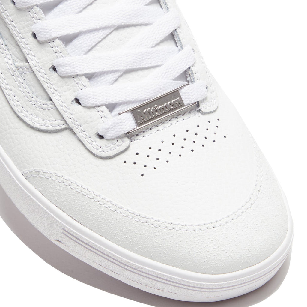 A white VANS sneaker with a silver logo on the side, specifically the VANS X ALLTIMERS ZAHBA LX VCU.