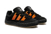 A pair of black and orange ADIDAS JAMAL SMITH ADIMATIC sneakers.