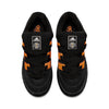 A pair of ADIDAS JAMAL SMITH ADIMATIC BLACK / ORANGE RUSH sneakers by ADIDAS on a white background.