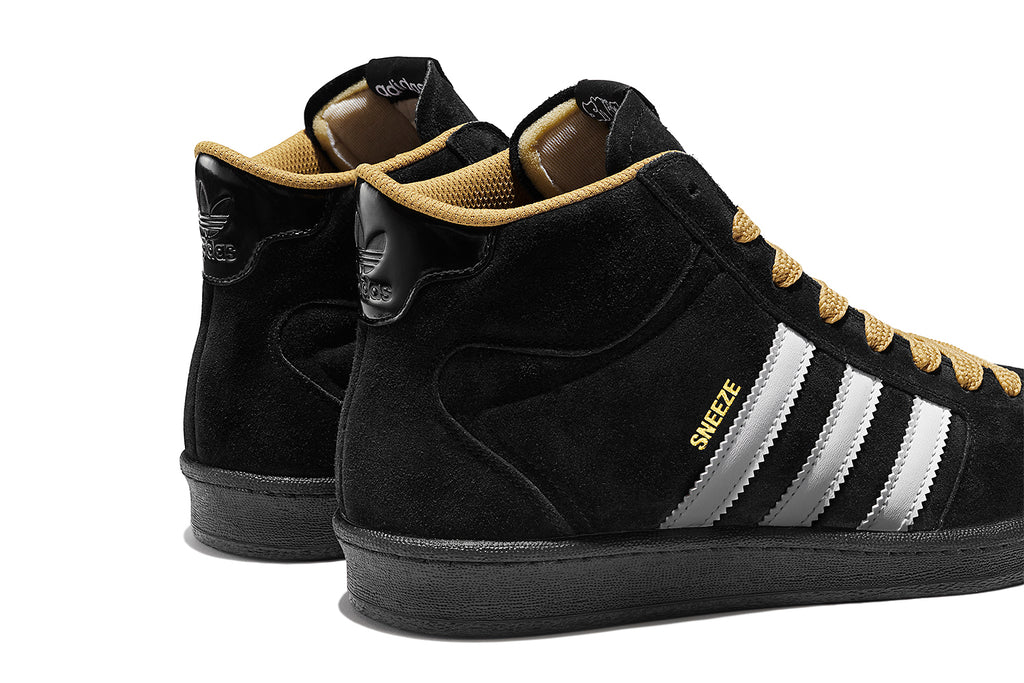 A pair of black and white ADIDAS X SNEEZE SUPERSKATE CORE BLACK / FTWR WHITE / GOLDEN BEIGE sneakers.
