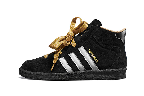 A pair of black and white ADIDAS X SNEEZE SUPERSKATE CORE BLACK / FTWR WHITE / GOLDEN BEIGE sneakers.