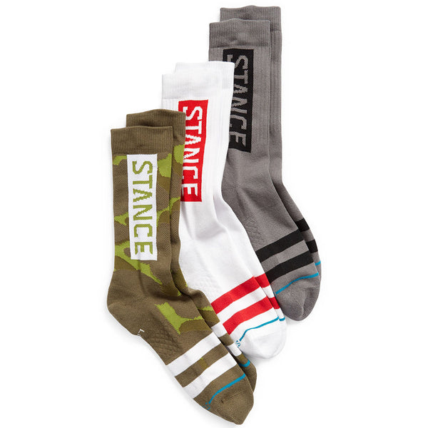 Three pairs of STANCE brand socks, including the STANCE SOCKS THE OG 3 PACK CAMO LARGE and other designs, displayed in a row.