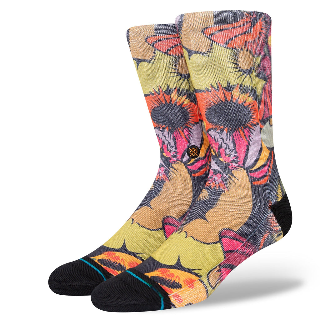 A pair of colorful STANCE GOOEY BLACK LARGE SOCKS with a bold floral and butterfly pattern on a white background.