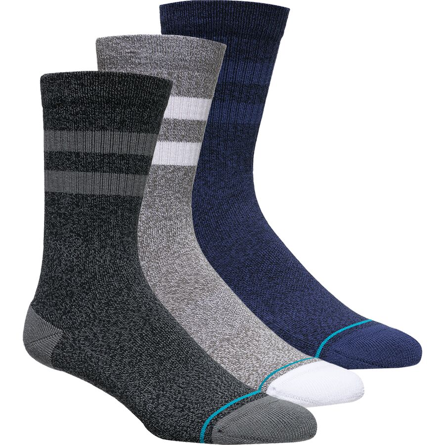 Three pairs of large crew socks in different colors and patterns, presented as part of the Stance Socks The Joven 3 Pack.