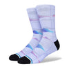 A pair of STANCE socks featuring a purple and blue abstract design on a white background, crafted by Nora Pembroke.