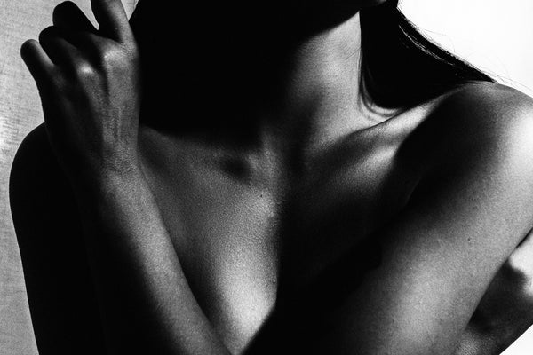 A black and white photo of a naked woman, taken by Self by Savannah Bockus from Bluetile Skateboards.