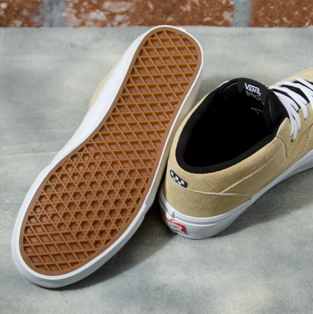 A pair of tan and white VANS SKATE HALF CAB TAUPE shoes from VANS.