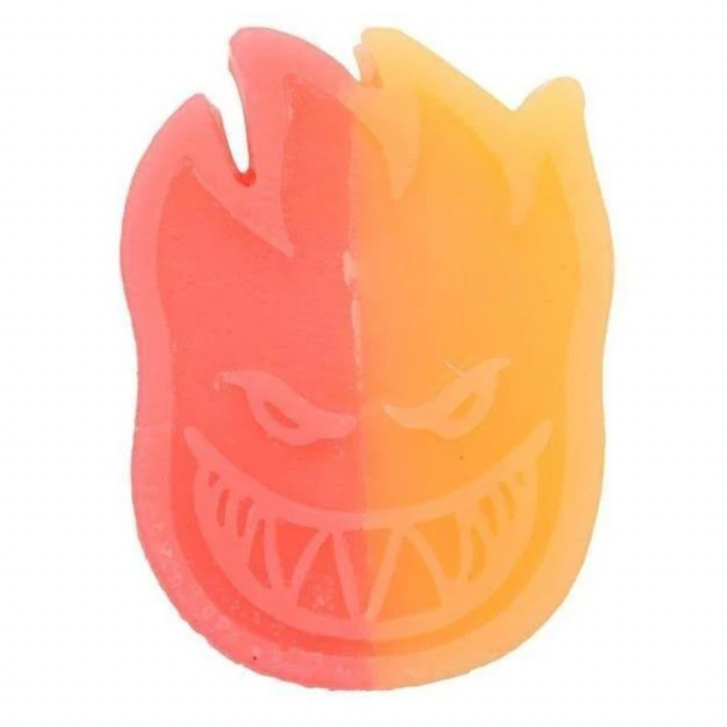 A SPITFIRE SWIRL FACE CURB WAX ORANGE RED candle with a SWIRL FACE design.
