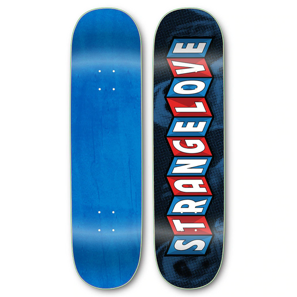 Two skateboard decks: the left deck is a plain blue from PS Stix, while the right deck features "STRANGELOVE" in bold, staggered red letters on a black-blue patterned background, branded as STRANGE LOVE CAROUSEL LOGO BLUE by STRANGELOVE.