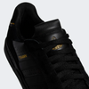 Black and gold ADIDAS TYSHAWN LOW shoes.