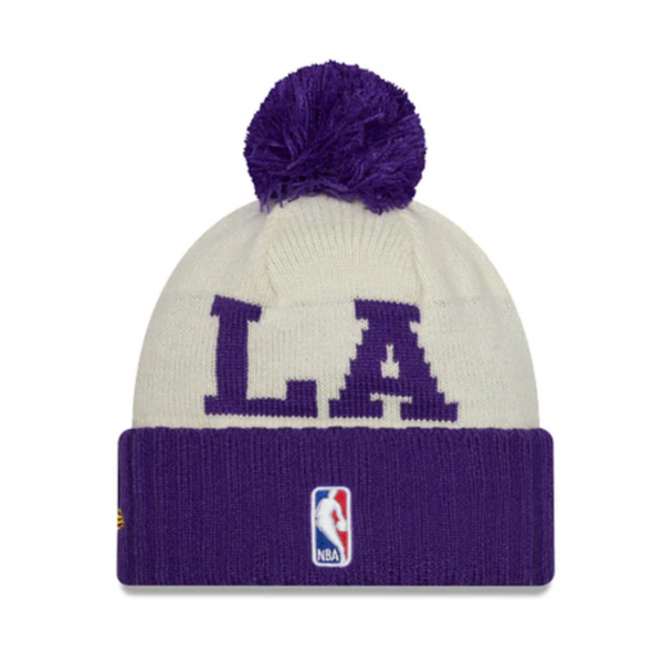A NEW ERA Los Angeles Lakers NBA Draft Pom Knit beanie in purple and white.
