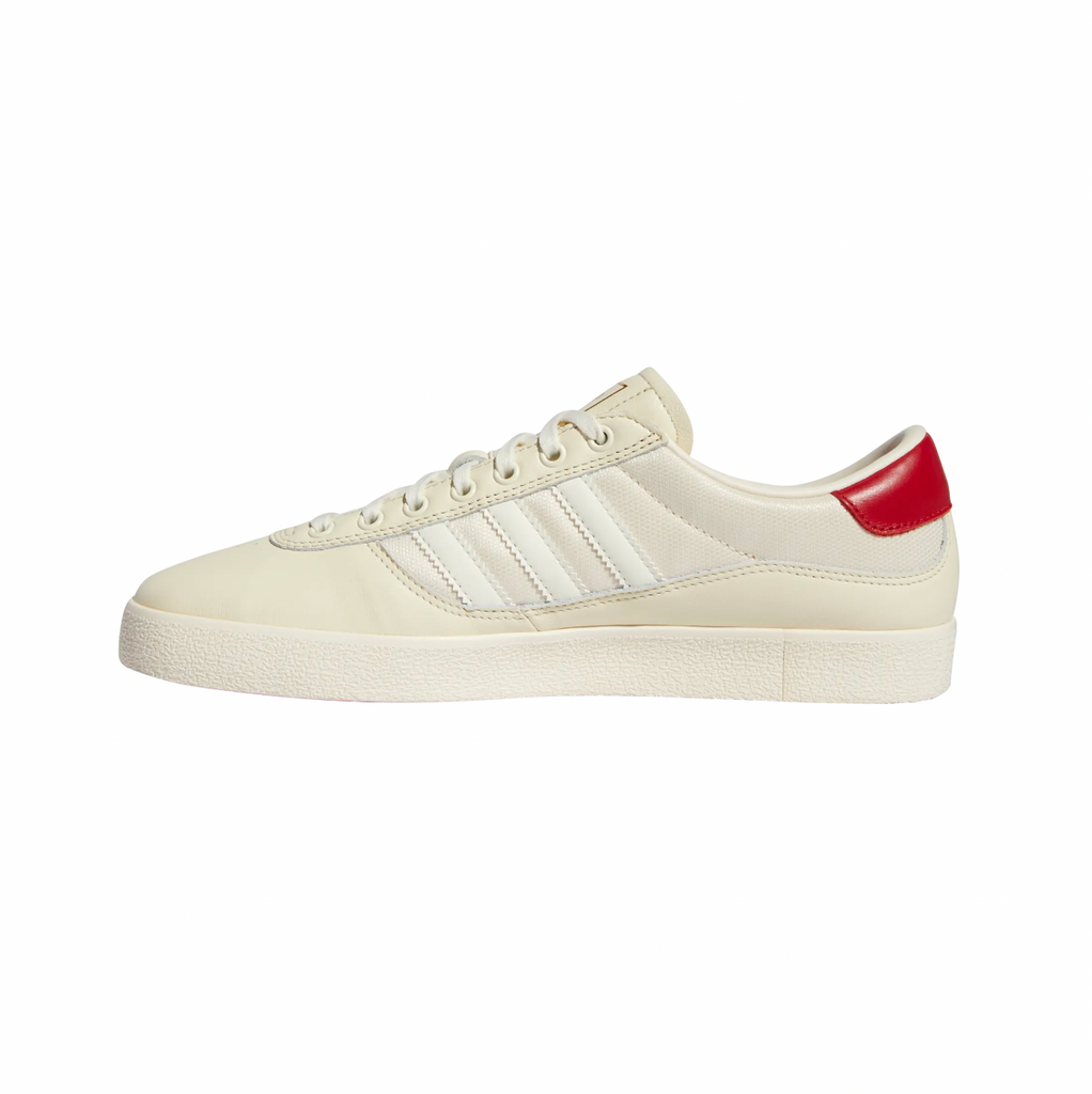 A white and red ADIDAS PUIG INDOOR WHITE / CREAM WHITE / SCARLET shoe.