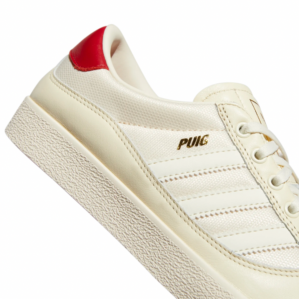 A pair of white ADIDAS PUIG INDOOR WHITE / CREAM WHITE / SCARLET sneakers.