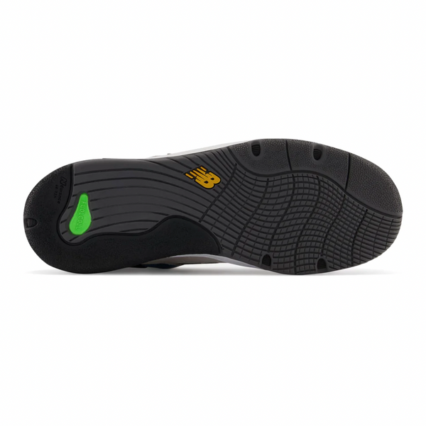 A pair of black and green NB Numeric 1010 Tiago Lemos White / Blue shoes on a white background.