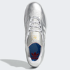 A pair of silver ADIDAS PUIG SILVER METALLIC/WHITE/SCARLET shoes with blue and red accents.