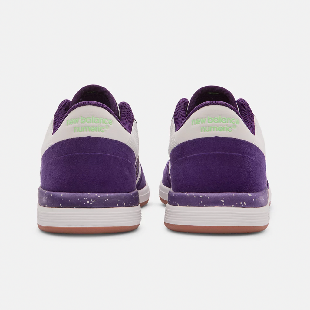 A pair of NB NUMERIC 420 purple and white tennis shoes.