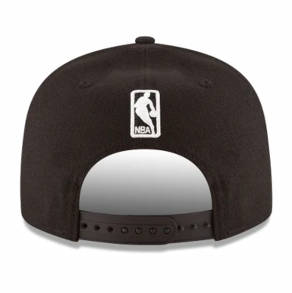 Back view of a black NEW ERA LOS ANGELES NBA DRAFT snapback cap showcasing the NBA logo embroidered in white.