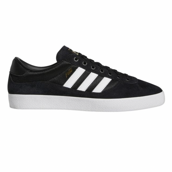 A black and white ADIDAS PUIG INDOOR sneakers.