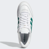 A pair of white and green ADIDAS TYSHAWN LOW FLAT WHITE / COLLEGIATE GREEN / METALLIC GOLD sneakers on a white background.