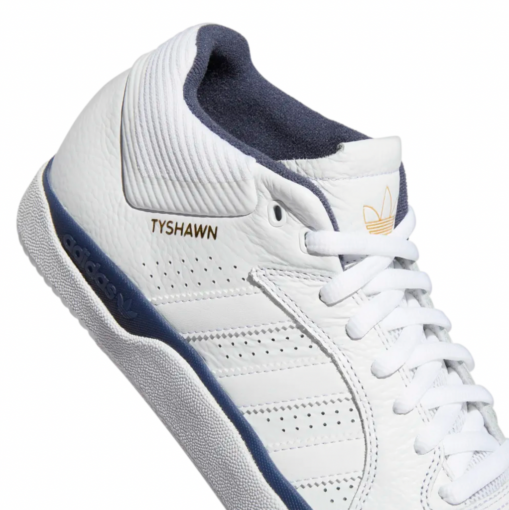 An ADIDAS TYSHAWN FLAT WHITE / SHADOW NAVY sneaker with a white sole.