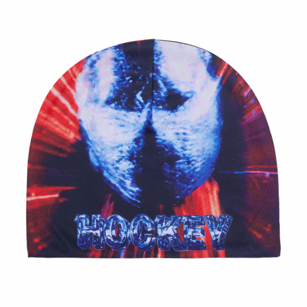 A blue and red HOCKEY powers & abilities beanie all over print with a picture of a man's face.