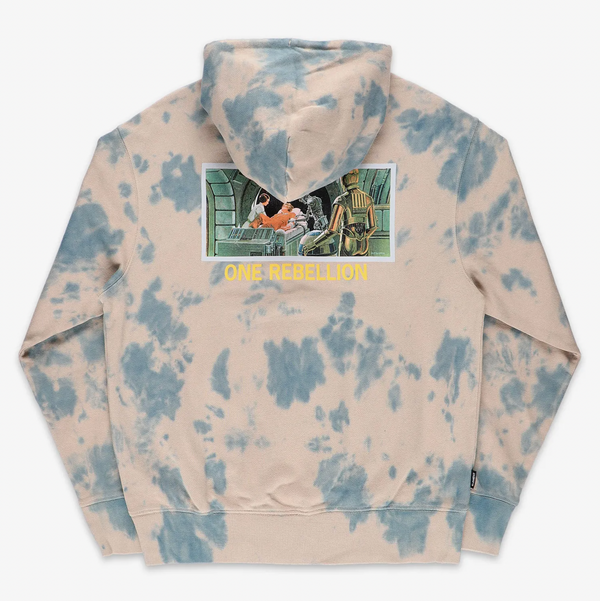 Introducing the ELEMENT X STARWARS GALAXY HOODIE BEIGE MARBLE: a STARWARS-themed tie-dye hoodie with a beige base and blue marble patterns. It features a striking graphic on the back depicting several figures in action, accompanied by the bold yellow text "ONE REBELLION.
