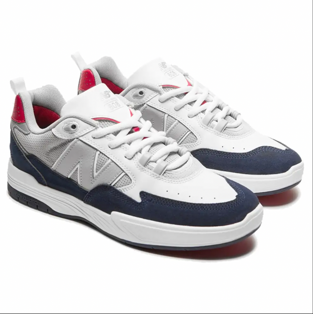 A pair of NB NUMERIC 808 Tiago white, blue, and red sneakers on a white background.