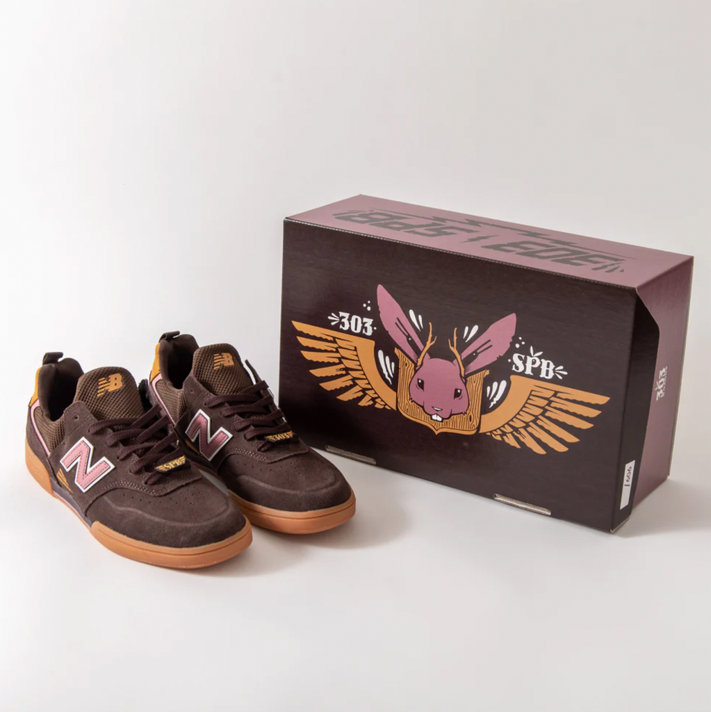 A pair of NB NUMERIC 288 JEREMY FISH X 303 BOARD SHOP shoes with an owl on them.