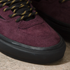 A close up of a pair of VANS SKATE HALF CAB OUTDOOR PURPLE / BLACK sneakers.