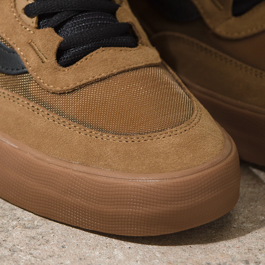 A close up of a person's VANS SKATE WAYVEE TOBACCO BROWN sneakers.