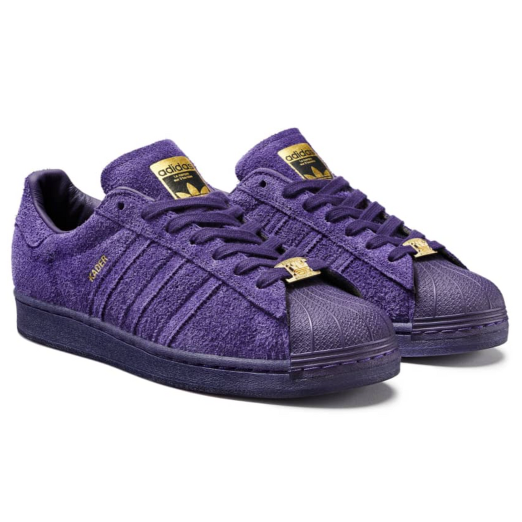 A pair of ADIDAS KADER SUPERSTAR ADV DARK PURPLE / GOLD METALLIC sneakers.