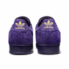 A pair of dark purple ADIDAS KADER SUPERSTAR ADV DARK PURPLE / GOLD METALLICs.