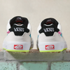 A pair of VANS SKATE NEON WAYVEE WHITE / MULTI sneakers on a brick wall with Wafflecup construction.