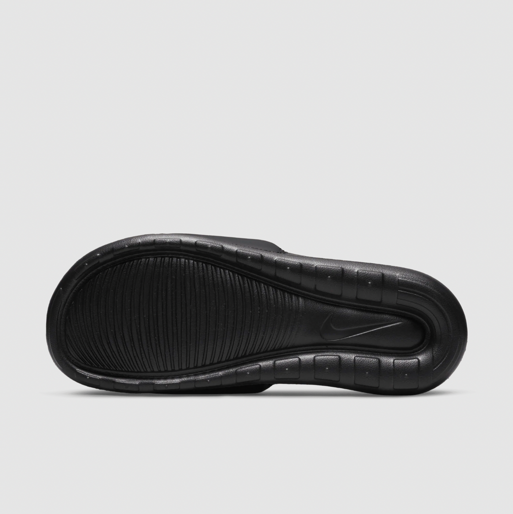 A pair of black Nike SB Victor One Slide SB Black/Team Orange shoes on a white background.