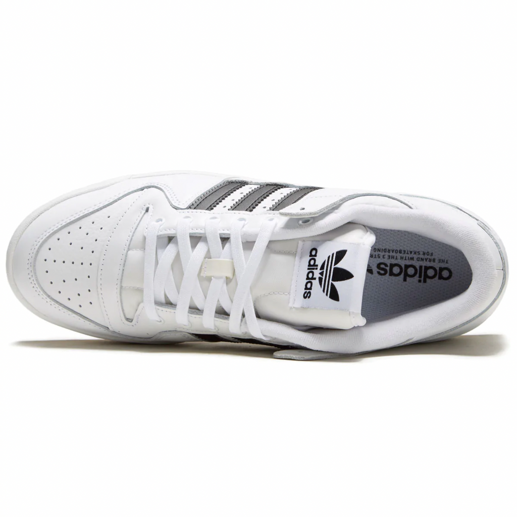 A pair of white Adidas FORUM 84 LOW ADV sneakers with black and white stripes.