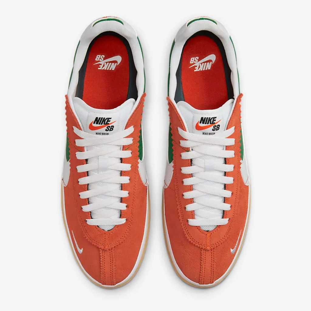 The NIKE SB BRSB DEEP ORANGE / PINE GREEN / WHITE is orange and green in color.